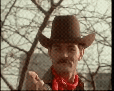 Man In Cowboy Hat And Red Bandana Thumbs Up GIF