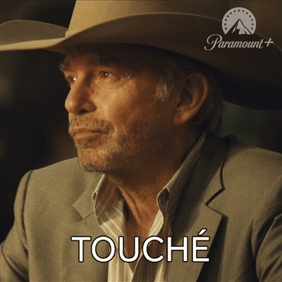 Man In Cowboy Hat And Suit Saying Touche GIF