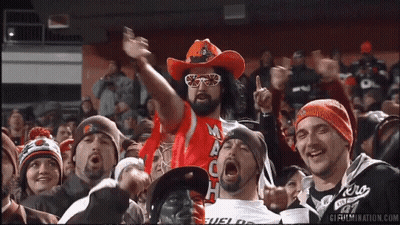 Man In Cowboy Hat And Sunglasses Cheering In Crowd GIF