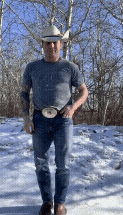 Man In Cowboy Hat And T-Shirt In Snow GIF