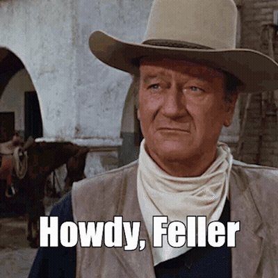 Man In Cowboy Hat And Vest Saying Howdy GIF