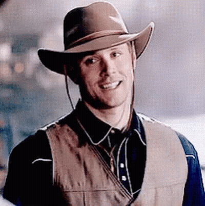 Man In Cowboy Hat And Vest Smiling GIF