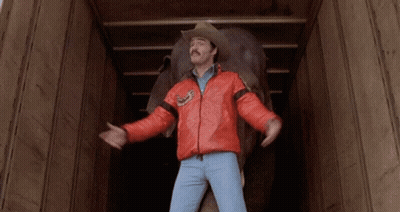 Man In Cowboy Hat Carrying Elephant In Truck GIF