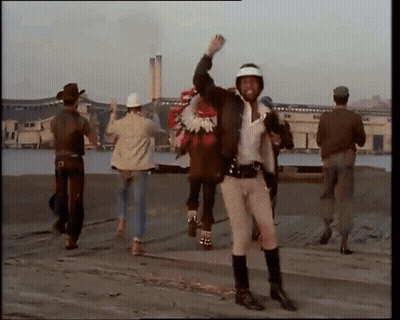 Man In Cowboy Hat Carrying Person On Back GIF