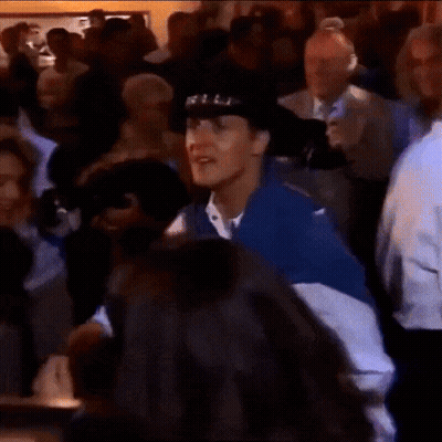 Man In Cowboy Hat Dancing In Crowded Room GIF