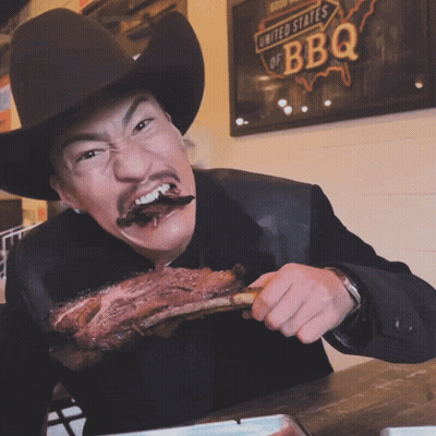 Man In Cowboy Hat Eating Meat At United States Of BBQ GIF