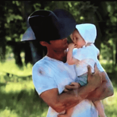 Man In Cowboy Hat Holding Baby GIF