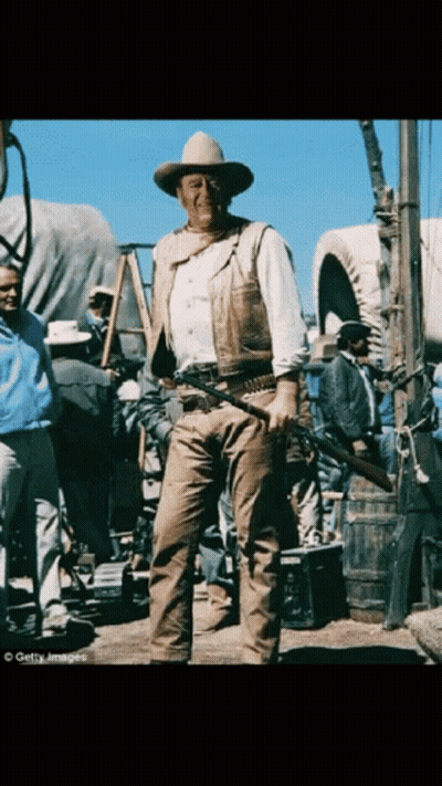 Man In Cowboy Hat Holding Gun GIF