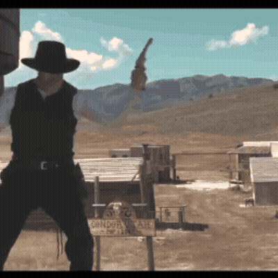 Man in Cowboy Hat Holding Gun at Condor Ranch