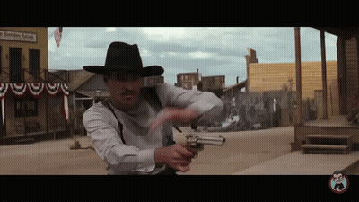 Man In Cowboy Hat Holding Gun In Front Of A Smoking Room GIF