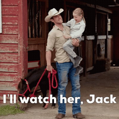 Man In Cowboy Hat Holding Little Girl Next To Pony GIF