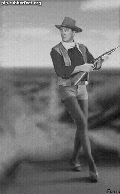 Man In Cowboy Hat Holding Rifle GIF