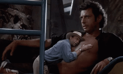 Man In Cowboy Hat Hugging Man In Blue Shirt GIF