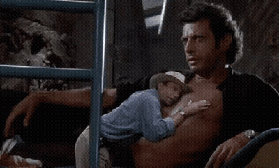 Man In Cowboy Hat Hugging Smaller Man On Chest GIF