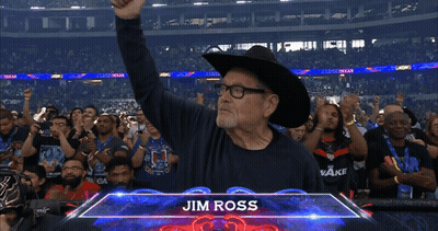 Man In Cowboy Hat In Front Of Jim Ross Sign GIF