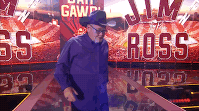 Man In Cowboy Hat In Front Of Jim Ross Sign GIF