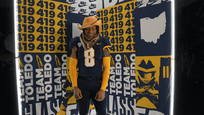 Man In Cowboy Hat In Front Of Nike Wall GIF