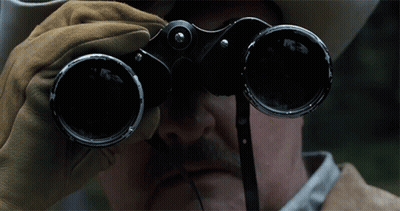 Man In Cowboy Hat Looking Through Binoculars GIF