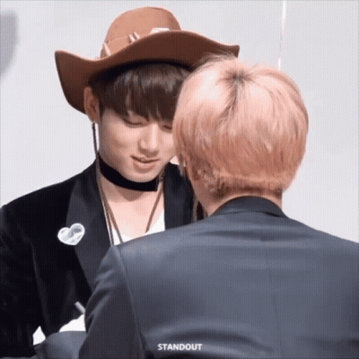 Man In Cowboy Hat Next To Suit GIF