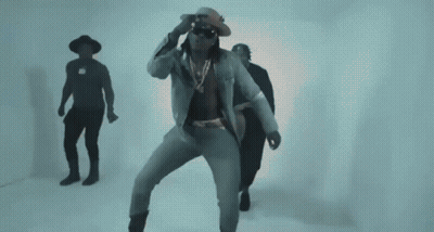 Man In Cowboy Hat Next To Woman In Orange Dress GIF
