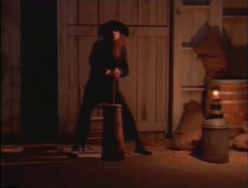 Man In Cowboy Hat Next To Woman GIF
