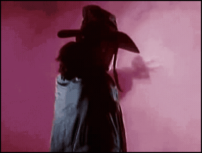 Man In Cowboy Hat On Pink Background GIF