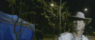 Man In Cowboy Hat On Roadside GIF