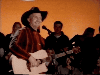 Man In Cowboy Hat Playing Guitar GIF