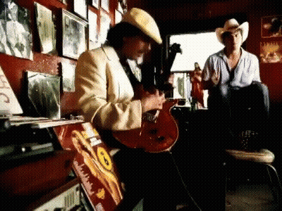 Man In Cowboy Hat Playing Guitar GIF