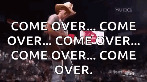 Man In Cowboy Hat Playing Guitar On Stage GIF