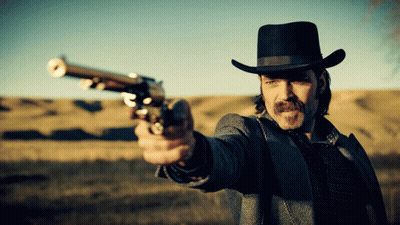 Man In Cowboy Hat Pointing Gun GIF