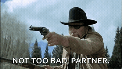 Man In Cowboy Hat Pointing Gun Saying Not Too Bad Partner GIF