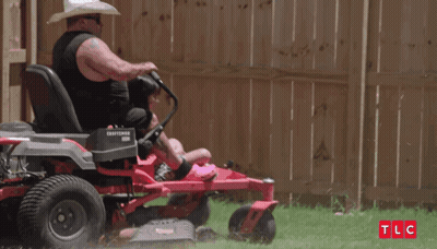 Man In Cowboy Hat Riding Lawn Mower With Daughter GIF