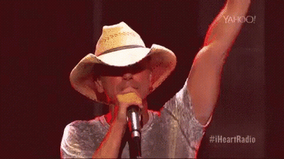 Man In Cowboy Hat Singing Into Microphone GIF