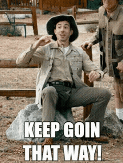 Man In Cowboy Hat Sitting On Rock Saying Keep Goin That Way GIF