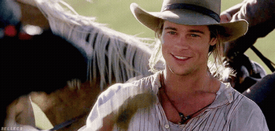 Man In Cowboy Hat Smiling Next To Horse GIF