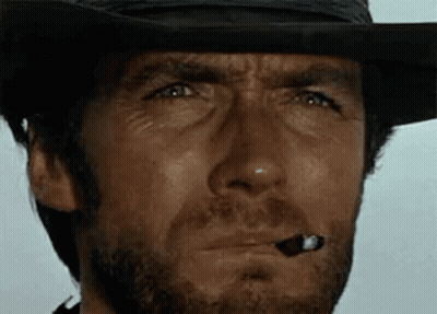 Man In Cowboy Hat Smoking Cigar GIF