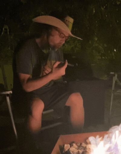 Man In Cowboy Hat Smoking Cigar GIF