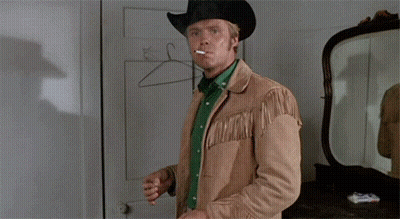 Man In Cowboy Hat Smoking Cigarette In Mirror GIF