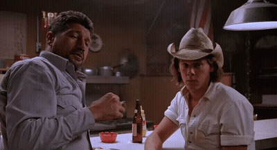 Man In Cowboy Hat Smoking With Man In White Shirt GIF