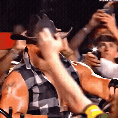 Man In Cowboy Hat Standing In Crowd GIF