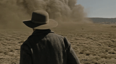 Man In Cowboy Hat Standing In Field GIF