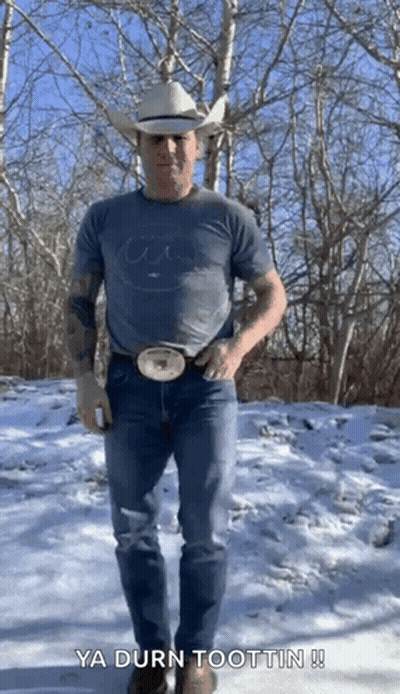 Man In Cowboy Hat Standing In Snow GIF