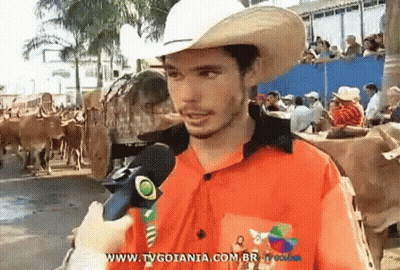 Man In Cowboy Hat Talking Into Microphone Www.tvgoiania.com.br GIF
