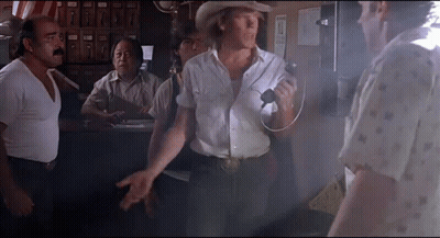 Man In Cowboy Hat Talking On Microphone GIF