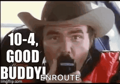Man In Cowboy Hat Talking On Phone GIF