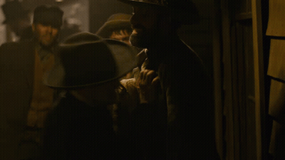 Man In Cowboy Hat Talking To Suit GIF