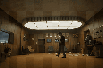 Man In Cowboy Hat Under Ceiling Light GIF