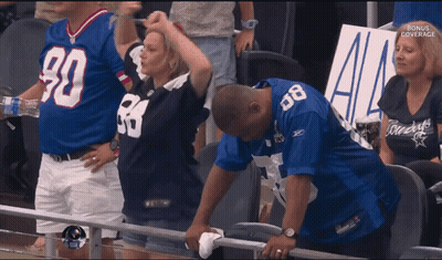 Man In Cowboy Jersey Wipes Face GIF
