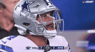 Man In Cowboys Helmet Looking At Scoreboard GIF